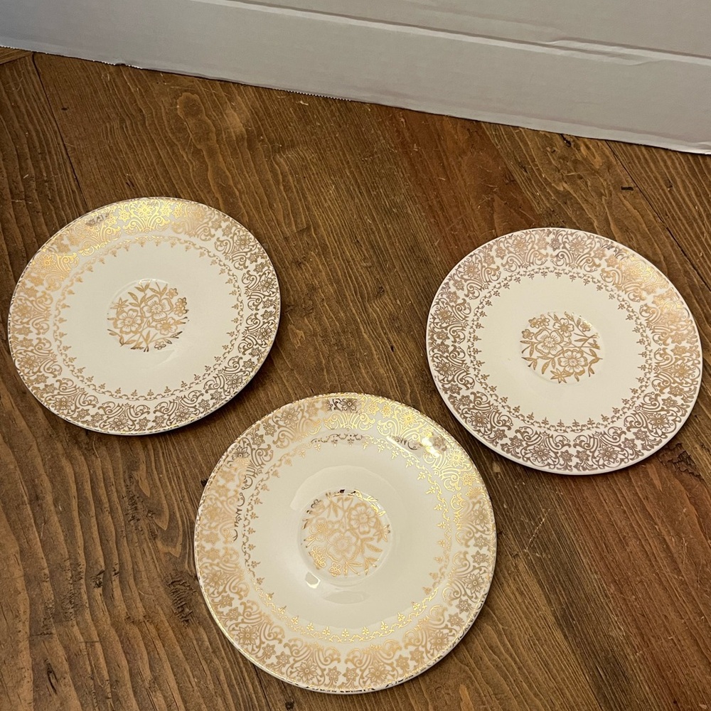 Set of 3 gold plated w/ floral design saucers.
